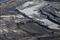 An aerial view of active bitumen open-pit mining in the Alberta tar sands near Fort McMurray.
