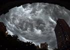 Clouds gather over apartment buildings ahead of a thunderstorm on the east side of Manhattan July 26;2012 in New York.