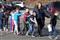 In this photo provided by the Newtown Bee;Connecticut State Police lead children from the Sandy Hook Elementary School in Newtown;Conn.;following a reported shooting there Friday;Dec. 14;2012.